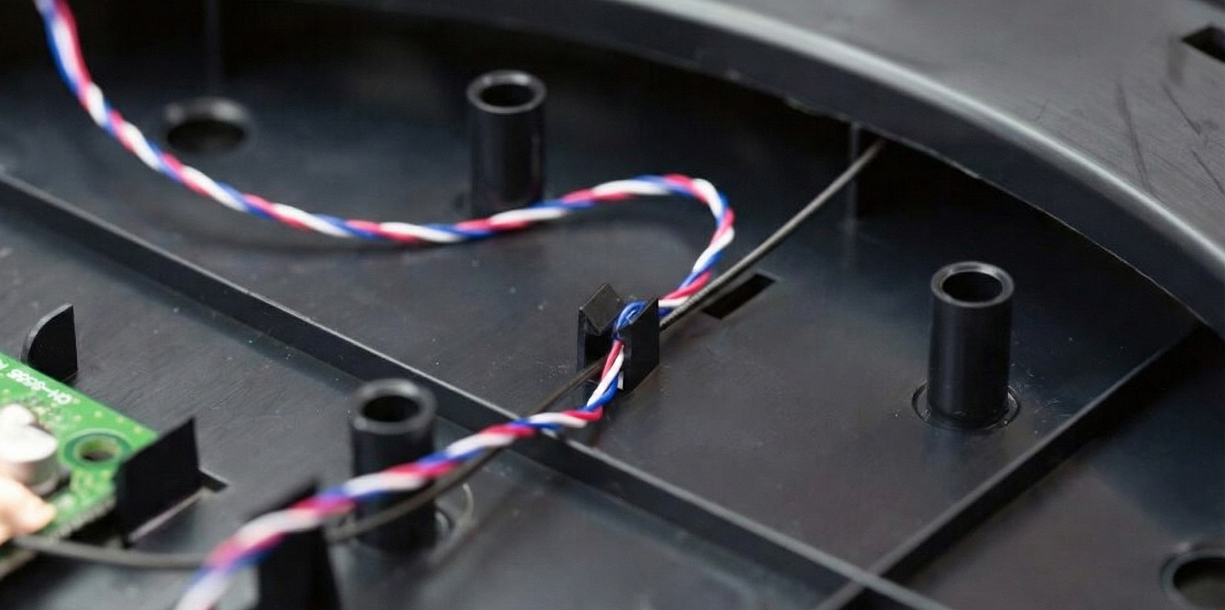 enclosure with built-in clips and channels for wire routing.